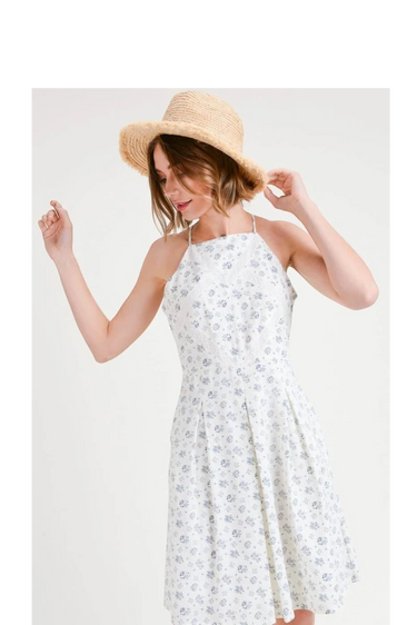 Floral Print Pleated Fit & Flare With Embroidery worn by a model with a summer hat, showcasing its elegant design.