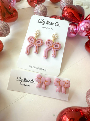 Pink Bow Earrings featuring delicate pink bow-shaped charms with a feminine design