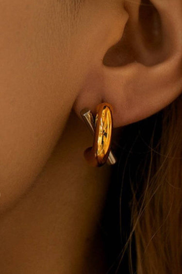 18K Gold PVD Plated Waterproof Stainless Steel Stud Earrings 7215 worn on an ear, showing the gold design