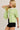Side view of model wearing green short sleeve sweater cardigan