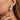 18K Gold Plated Waterproof Stainless Steel Hoop Earrings 7101 worn on an ear