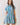 Blue Stripe Button Down Shirt Mini Dress on a model showcasing its collared design and cinched waist.