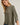 Close-up of model wearing olive green Round Neck 3-4 Sleeve Top