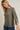 Close-up of model wearing olive green Round Neck 3-4 Sleeve Top