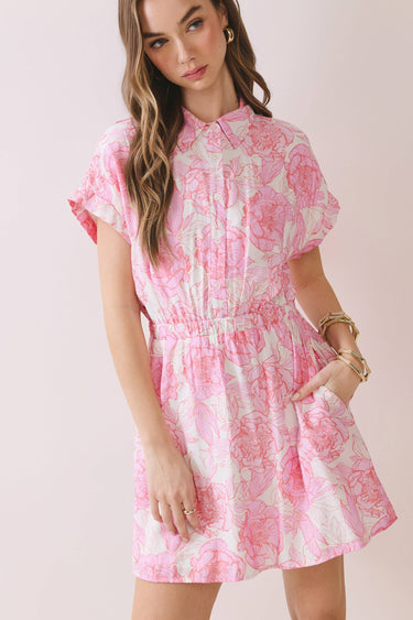 Floral Print Elastic Waist A Line Mini Dress modeled by a woman with long hair, featuring a collared neckline and side pockets.