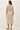 Back view of a woman wearing a STRIPED COTTON MIDI DRESS with a utility style and collar.