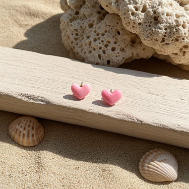 Mini Valentines Studs featuring tiny red and pink heart designs displayed on a decorative surface