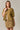Model wearing mustard yellow short sleeve sweater cardigan