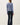 Back view of model wearing blue Ultra Soft Essential Basic Crewneck Button Up Cardigan with pants