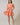 Model wearing the Dixie Split Neck Shift Dress Drift Floral in vibrant pinks with pockets and a split neckline.