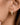 18K Gold Plated Waterproof Stainless Steel Hoop Earrings 7112 worn on a model's ear