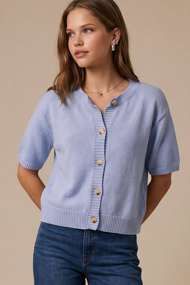 Model wearing blue short sleeve sweater cardigan