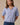 Model wearing blue short sleeve sweater cardigan