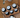 Rosemary Mint Beeswax Lotion Bars arranged with essential oils