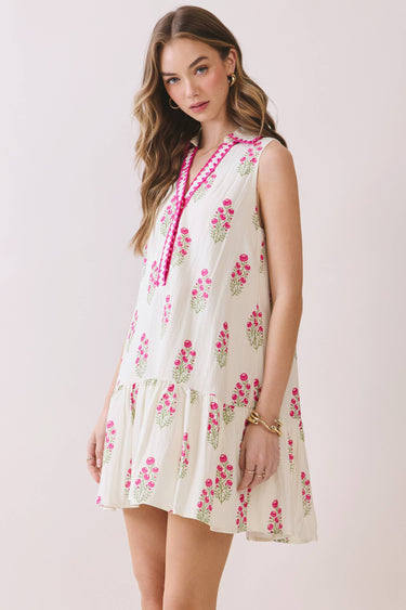 Floral Print Sleeveless Tiered Babydoll Dress worn by a model showcasing its relaxed babydoll silhouette and tiered skirt.