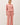 Model wearing pink cotton modal fleece sweatshirt, full length view