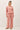 Model wearing pink cotton modal fleece sweatshirt, full length view