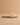 The Andrea Natural Bow Raffia Slide Feminine Summer Flat showcasing raffia woven strap and bow accent.