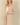 Shop Wall beige long sleeve open front cardigan with side pockets worn by a blonde model against a neutral background