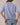 Back view of model wearing blue short sleeve sweater cardigan