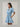 Gabriella Denim Fray Mini Dress styled with fringe details and cinched tie-waist, in lt denim color, featuring short sleeves and pockets.