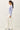 Side view of model wearing light blue Ultra Soft Boatneck Basic Long Sleeve Top