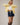 Side view of model wearing yellow Round Rolled Hemline Detail Thin Sweater Cardigan