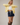 Side view of model wearing yellow Round Rolled Hemline Detail Thin Sweater Cardigan