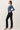 Ribbed Button Up Cardigan side view in blue with black pants