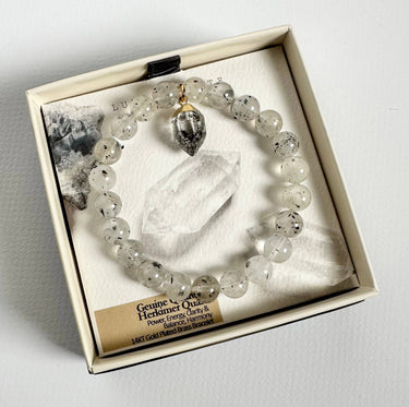 Everyday Charm Stretch Bracelet - Quartz Herkimer Quartz presented in an elegant box with genuine quartz beads and charm.