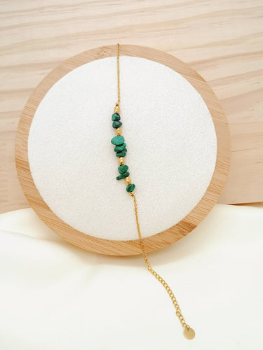 Gold chain bracelet with green stones