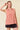 Striped Yoke Top in pink front view with black skirt