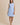 Light blue boat neck sleeveless side tie mini dress worn by a model, full-body view.