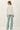 Back view of model wearing light-colored raglan sleeve pullover sweater