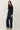 Side view of model wearing purple [NEW COLOR] Ribbed Crewneck Cardigan in black
