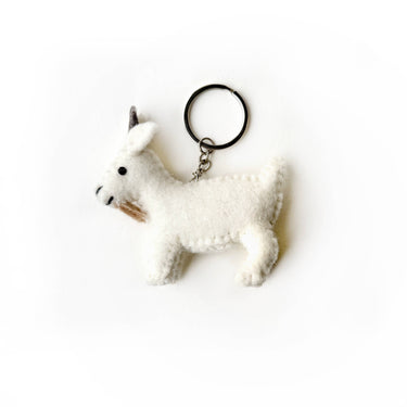 White goat felt wool keychain isolated on a white background with metal ring