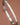 Tarnish-Resistant Waterproof Stainless Steel Bangle 7040 showcasing the smooth metallic finish on a brown background