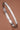 Tarnish-Resistant Waterproof Stainless Steel Bangle 7040 showcasing the smooth metallic finish on a brown background