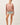 Full-length view of model wearing pink long sleeve top with denim shorts