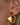 18K Gold PVD Plated Waterproof Stainless Steel Hoop Earrings 7192 worn on an ear, showcasing the geometric design