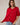 Model wearing red short sleeve sweater cardigan with jeans