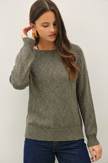 Model wearing olive green raglan sleeve slub pullover sweater