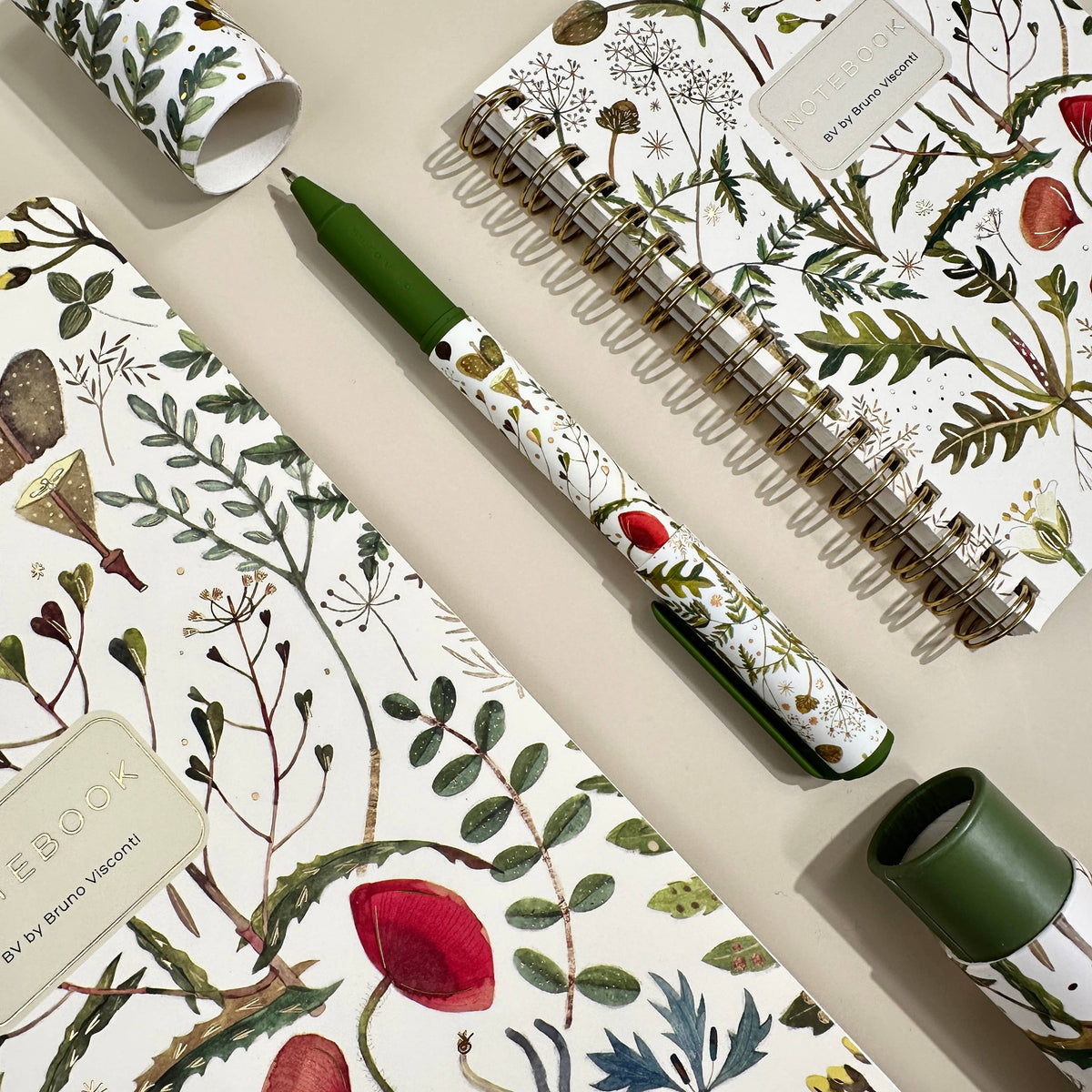 DreamWrite Bloom Pen in decorative gift tube featuring floral illustrations and smooth black ink tip.