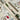 DreamWrite Bloom Pen in decorative gift tube featuring floral illustrations and smooth black ink tip.