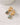 The Classic Form Labradorite Huggie Hoops featuring gold-plated design and faceted labradorite stones.