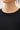 Close-up detail of black short sleeve top neckline and fabric