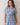 Embroidered Floral Tiered Button Down Midi Dress featuring a collared neckline and short sleeves, modeled by a young woman.