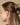 Large Arched Clip Black securely holding thick hair in a stylish updo, featuring an eco-friendly design.