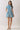 Blue Stripe Button Down Shirt Mini Dress worn by model, featuring a classic collar and cinched waist with pockets.