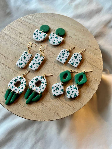 St. Patrick's Day Earrings Clover Clay Earrings Lucky - Assorted lightweight polymer clay earring designs on a wooden tray.